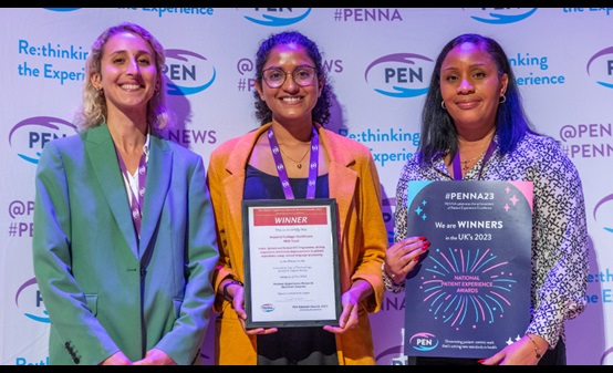 Three women receiving award