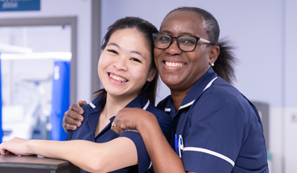 Two smiling nurses
