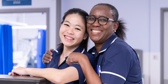 Two smiling female nurses