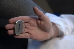 Hypoglossal nerve stimulation device