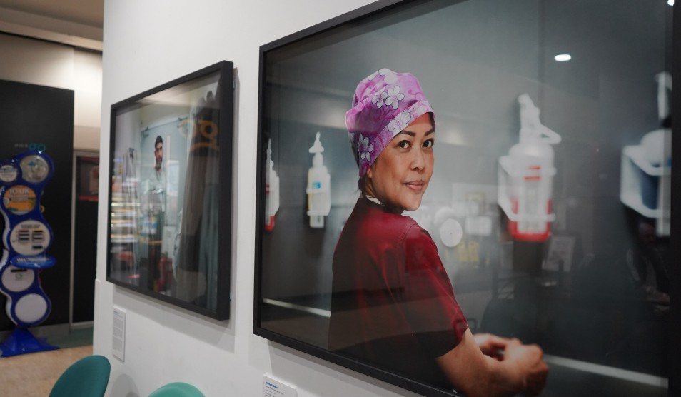 Photo of Open Britain exhibition focused on a portrait of Rhona Eslabra, who is a matron and theatre manager