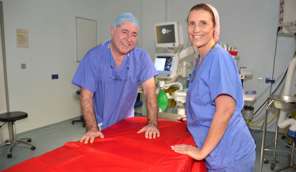 Photo of Professor Richard Smith and Miss Isabel Quiroga in scrubs