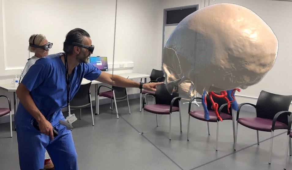 Neurosurgeon demonstrates the technology to a patient