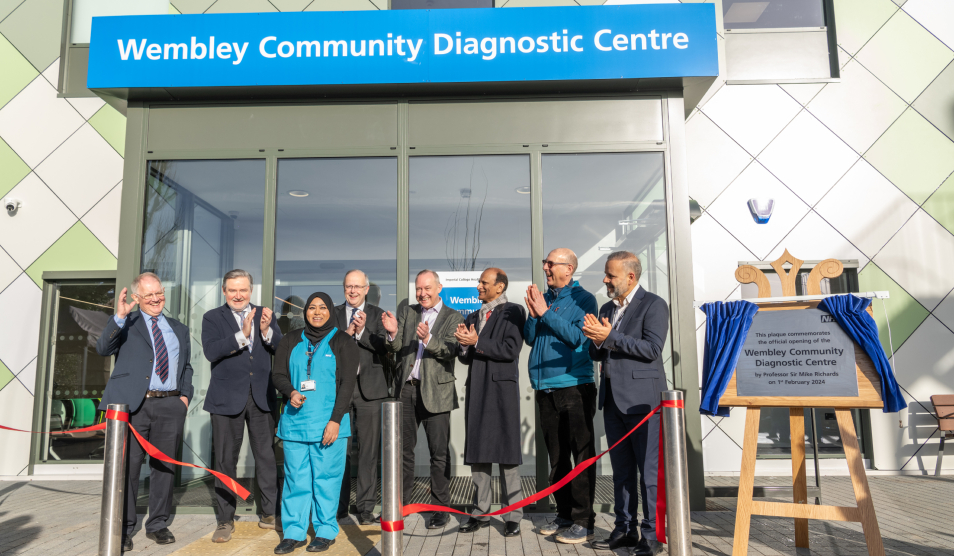 Local leaders and staff cutting ribbon to formally open the centre