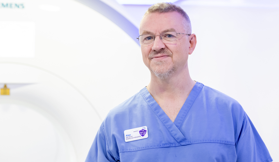 White man with beard in scrubs