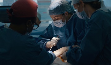 Close up photo of major trauma centre colleagues operating on a patient at St Mary's Hospital.