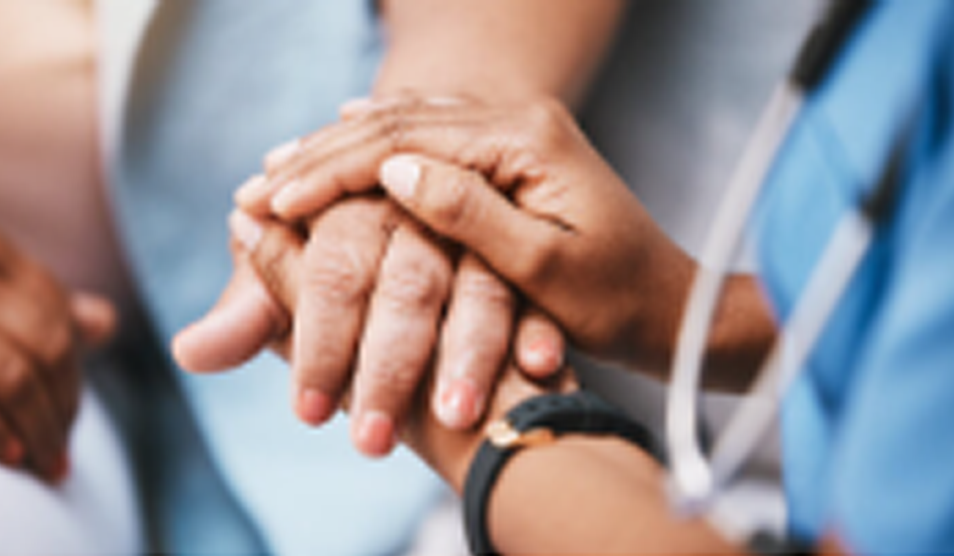 Close up of nurse holding patient's hands