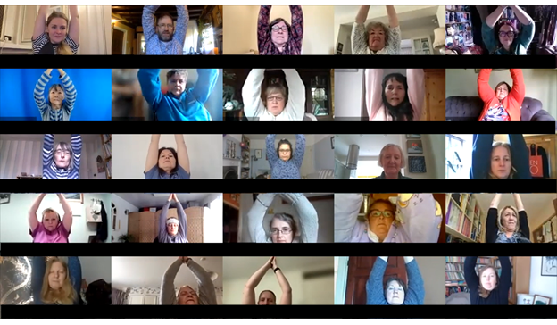 A screenshot of an online ENO Breathe session, with participants engaging in a shoulder stretch exercise