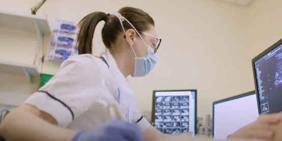 Photo of nurse at computer screen