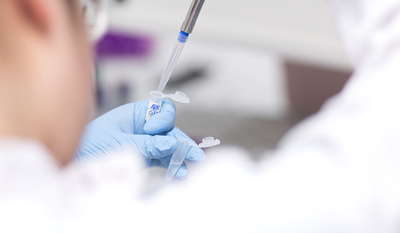 Close-up of clinician with test tube