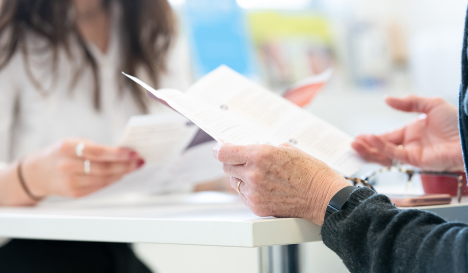 Patient and nurse reading leafles