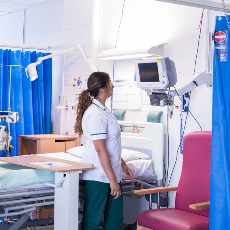 Nurse looking at monitor