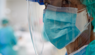 Closeup photo of clinical staff member wearing full PPE