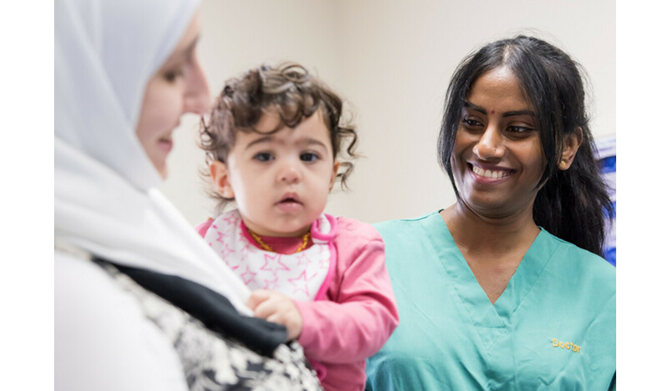 Photo of female patient with child and nurse Photo of female patient with child and nurse