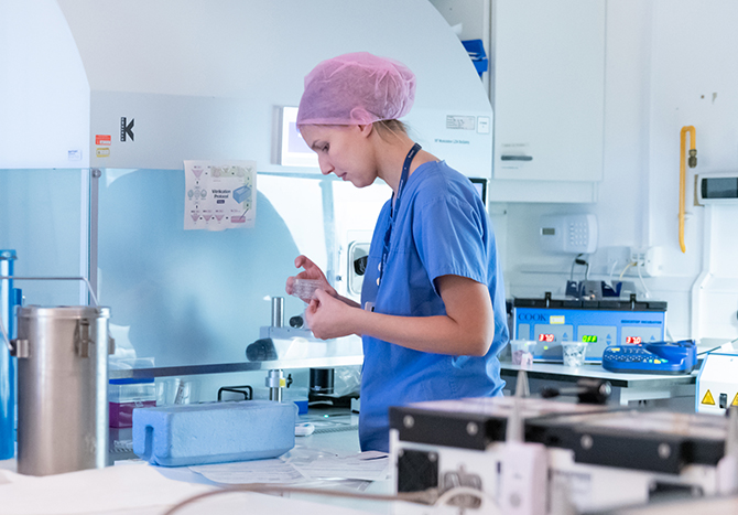 Researcher with petri dish