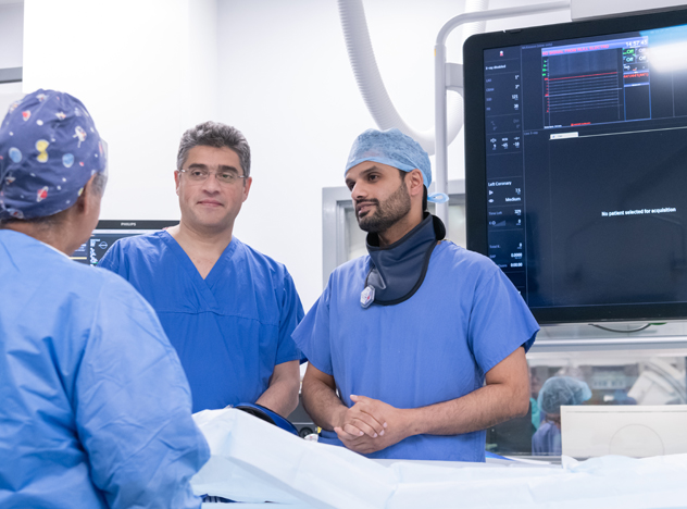 Doctors and nurse engaging in cardiac day ward