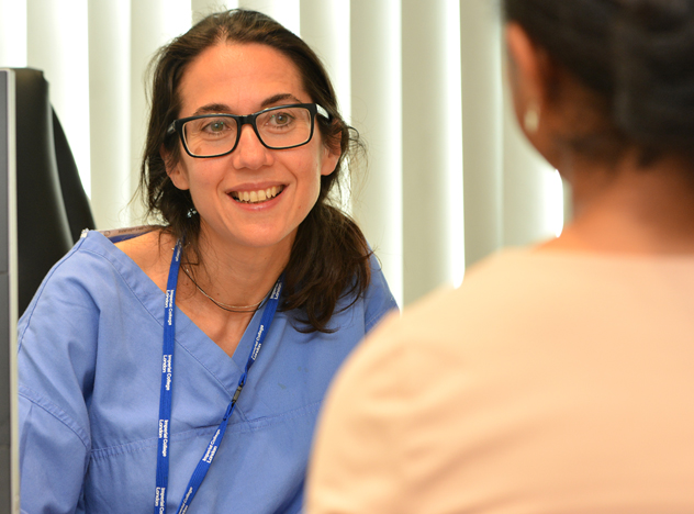 Nurse talking to a patient Nurse talking to a patient