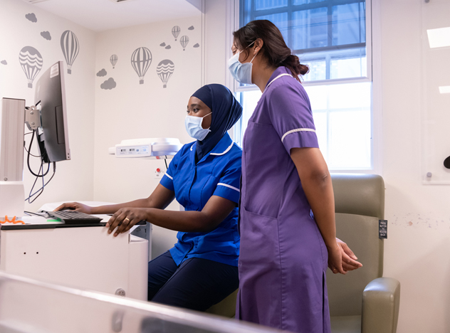 Nurse looking at a screen