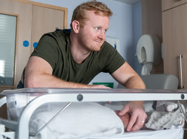 Father with newborn baby