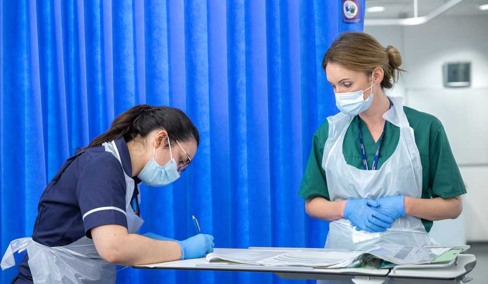 Nurses taking notes