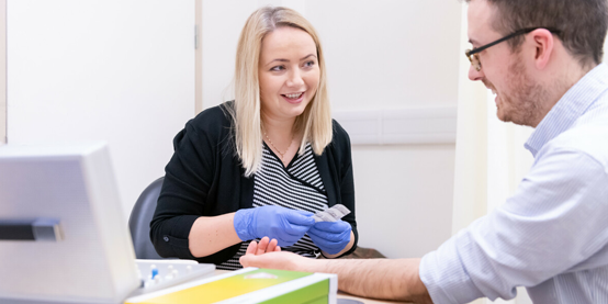 Consultant In Allergy, Respiratory Medicine Florentina Dumitru carries out a skin prick test on a patient.
