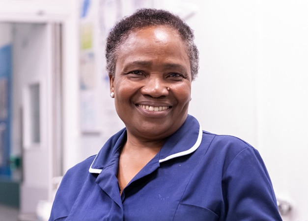 member of maternity staff smiling towards the camera